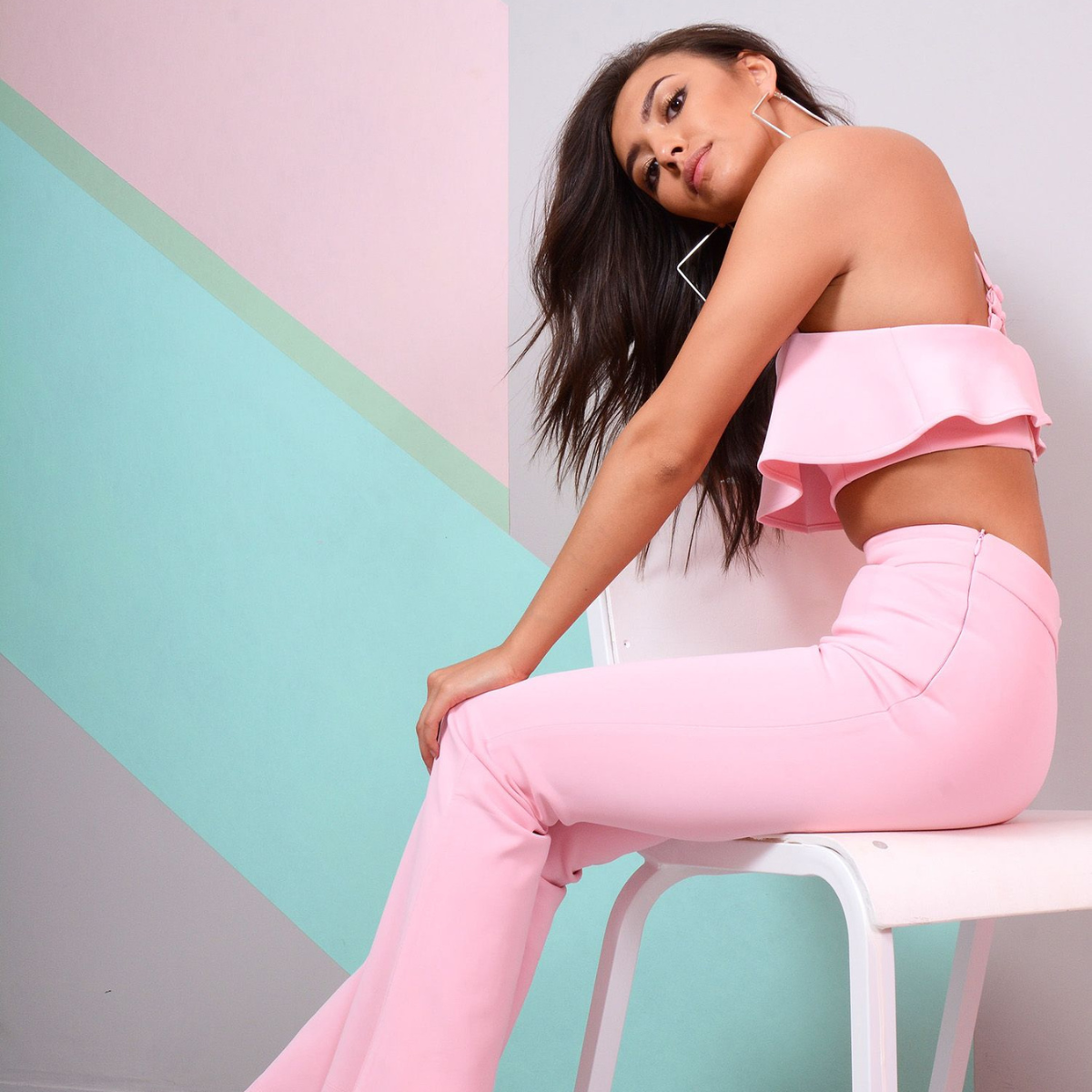 Pink Co-ord With Ruffle Crop Top And Bootleg Trouser (Sitting Side)